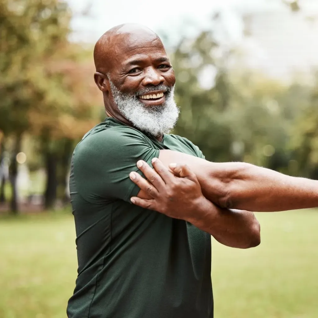 Smiling older man outdoors in athletic wear